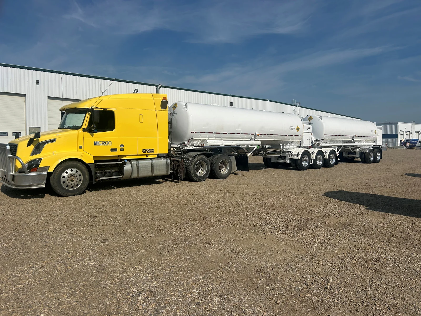 Yellow Micron truck with cryogenic tank trailers